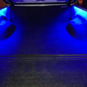 A car with blue lights on the floor