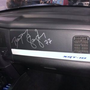 A car dashboard with the word " graffiti " written on it.