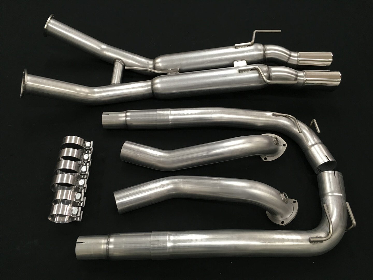 A set of pipes and tubes are laid out on the table.