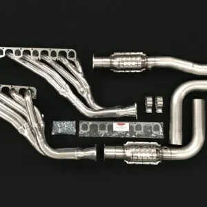 A set of exhaust pipes and manifolds on a black background.