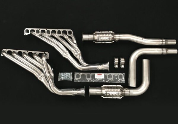 A set of exhaust pipes and manifolds on a black background.