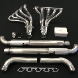 A set of exhaust pipes and headers on top of a table.