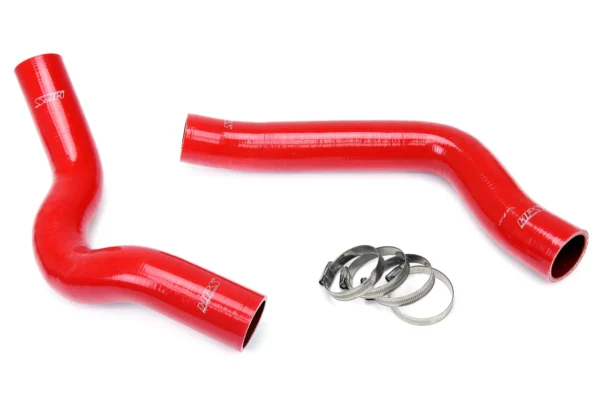 A red hose and its parts are laying on the ground.