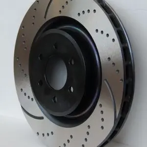 A disc brake is shown with holes in it.