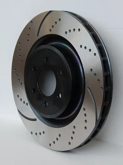 A disc brake is shown with holes in it.