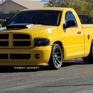 A yellow truck is parked on the street.
