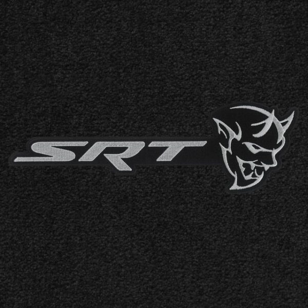 A black and white srt logo on the front of a car.