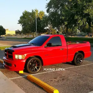 A red truck parked in the parking lot.