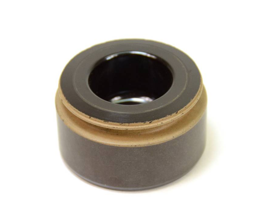 A black and brown piece of metal with a wooden ring around it.
