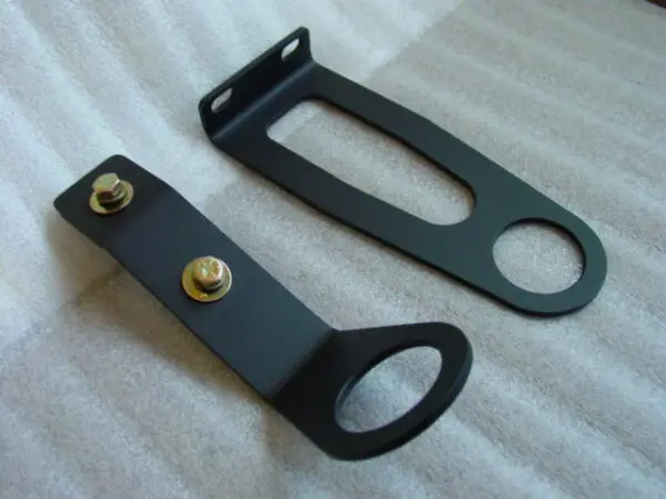 A pair of black metal brackets with one attached to the other.