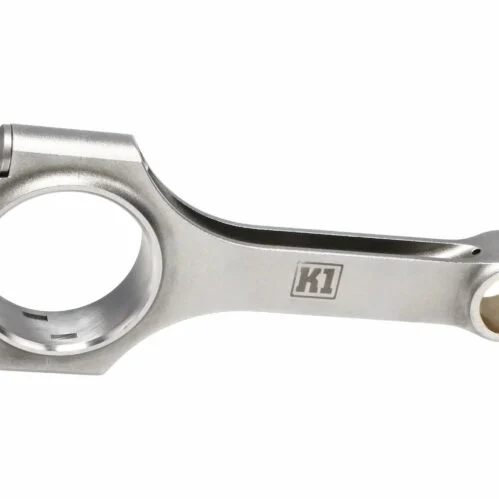 A chrome plated connecting rod with the letter k on it.