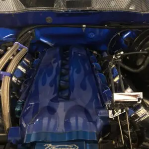 A blue engine with flames on it