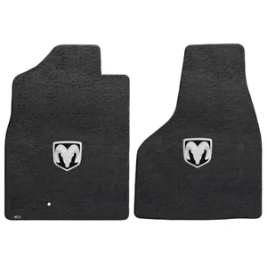 A pair of black floor mats with a ram logo.