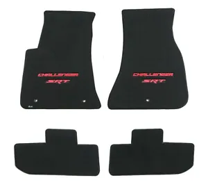 A set of four floor mats with the word challenger on them.