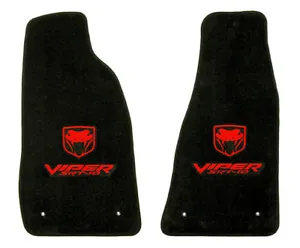 A pair of black floor mats with red lettering.