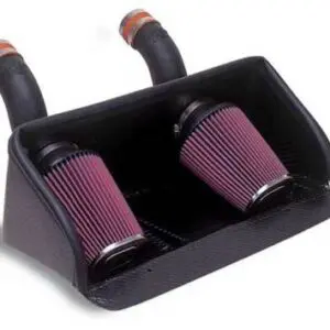 A pair of air filters are attached to the side of a car.