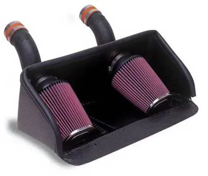A pair of air filters are attached to the side of a car.