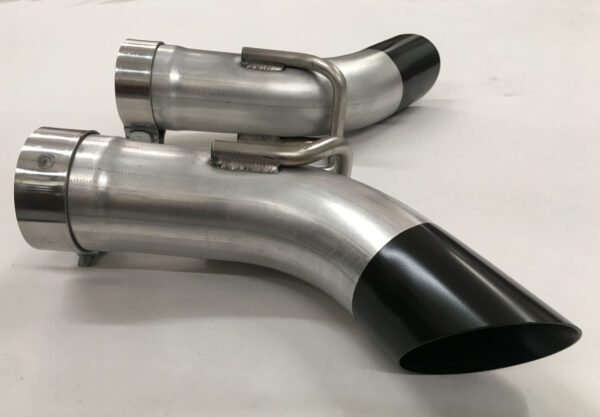 A pair of exhaust pipes sitting on top of a table.