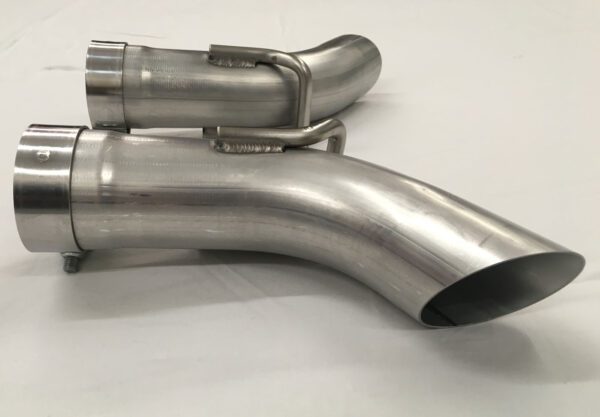 A close up of the side pipes on a motorcycle