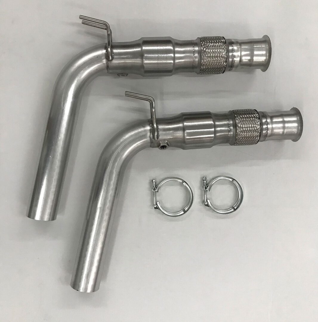 A pair of exhaust pipes with clamps attached to them.