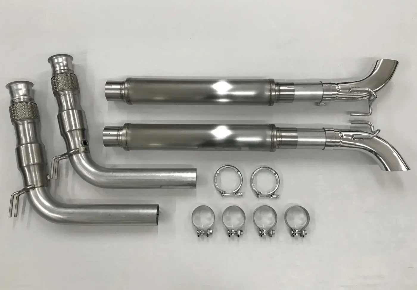 A pair of exhaust pipes and other parts.