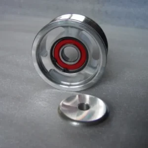 A metal object with a red ring on it.