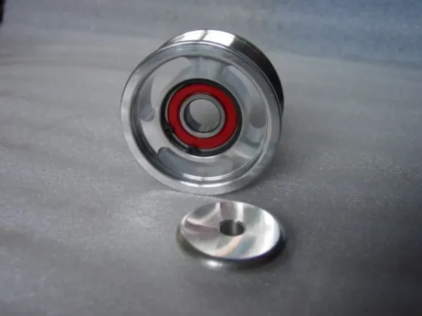 A metal object with a red ring on it.