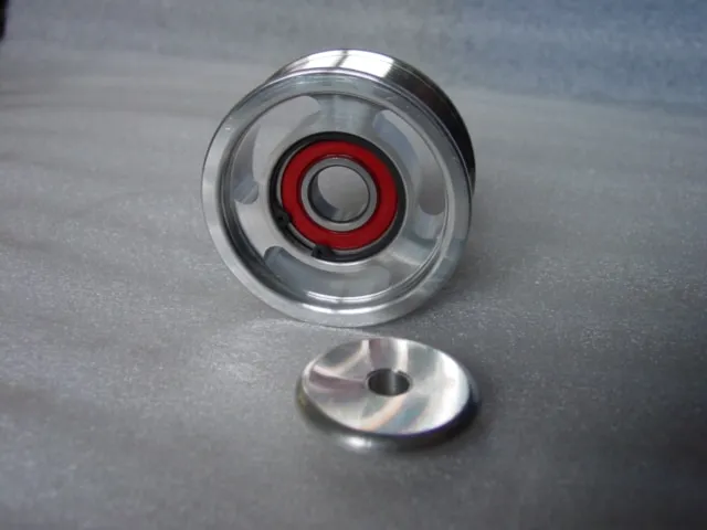 A metal object with a red ring on it.