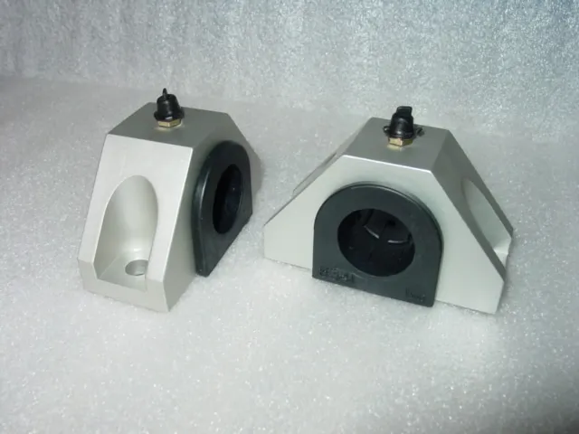 A pair of white and black plastic blocks.