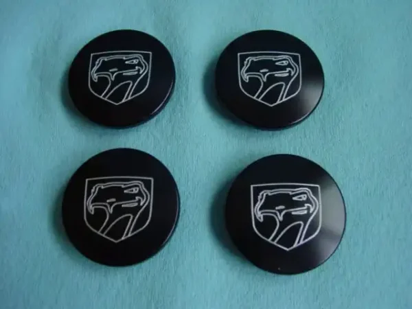 A set of four black mopar logo buttons.