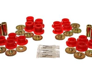 A set of red bushings and bushes are sitting on top of a table.