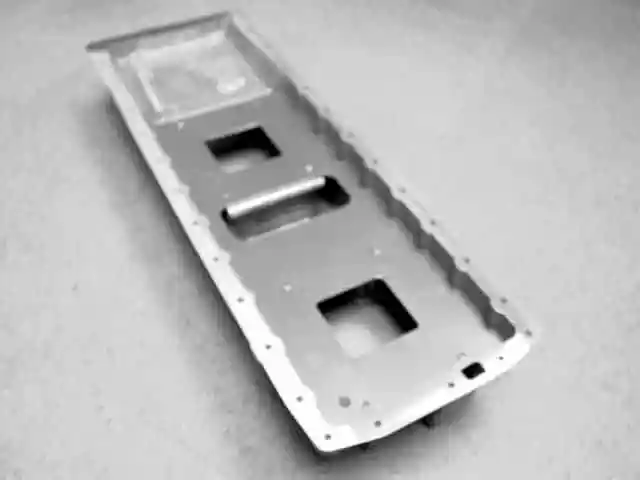 A metal frame with three holes in it.