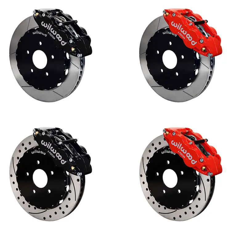A set of four brake discs with red calipers.