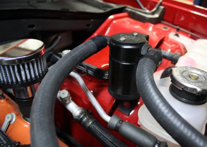 A close up of the engine compartment of a car